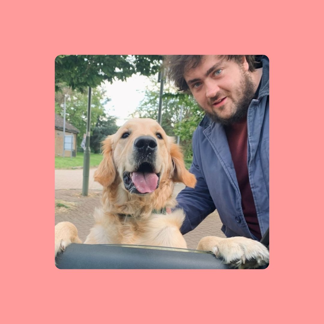 A man and a golden retriever taking a selfie