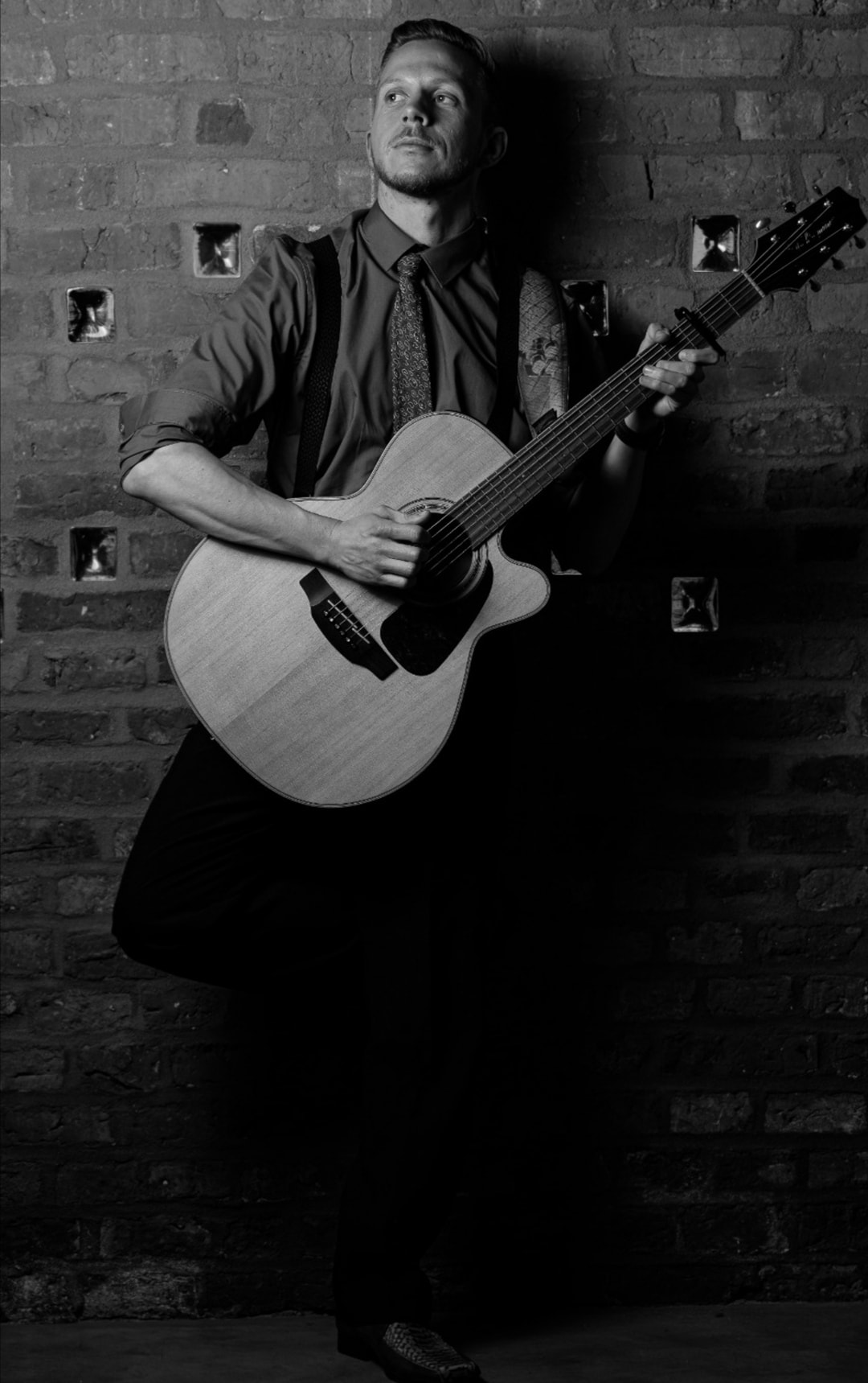Fingerstyle Acoustic Guitarist Adam Performing Contemporary Hits